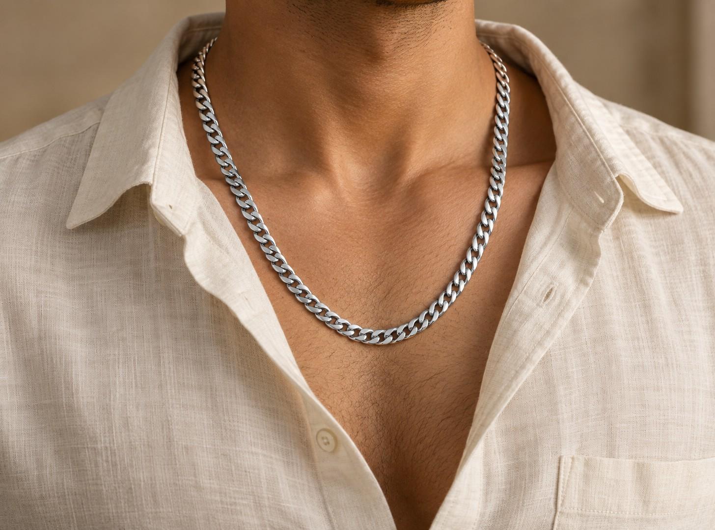Silver-look men's curb chain worn with a linen shirt