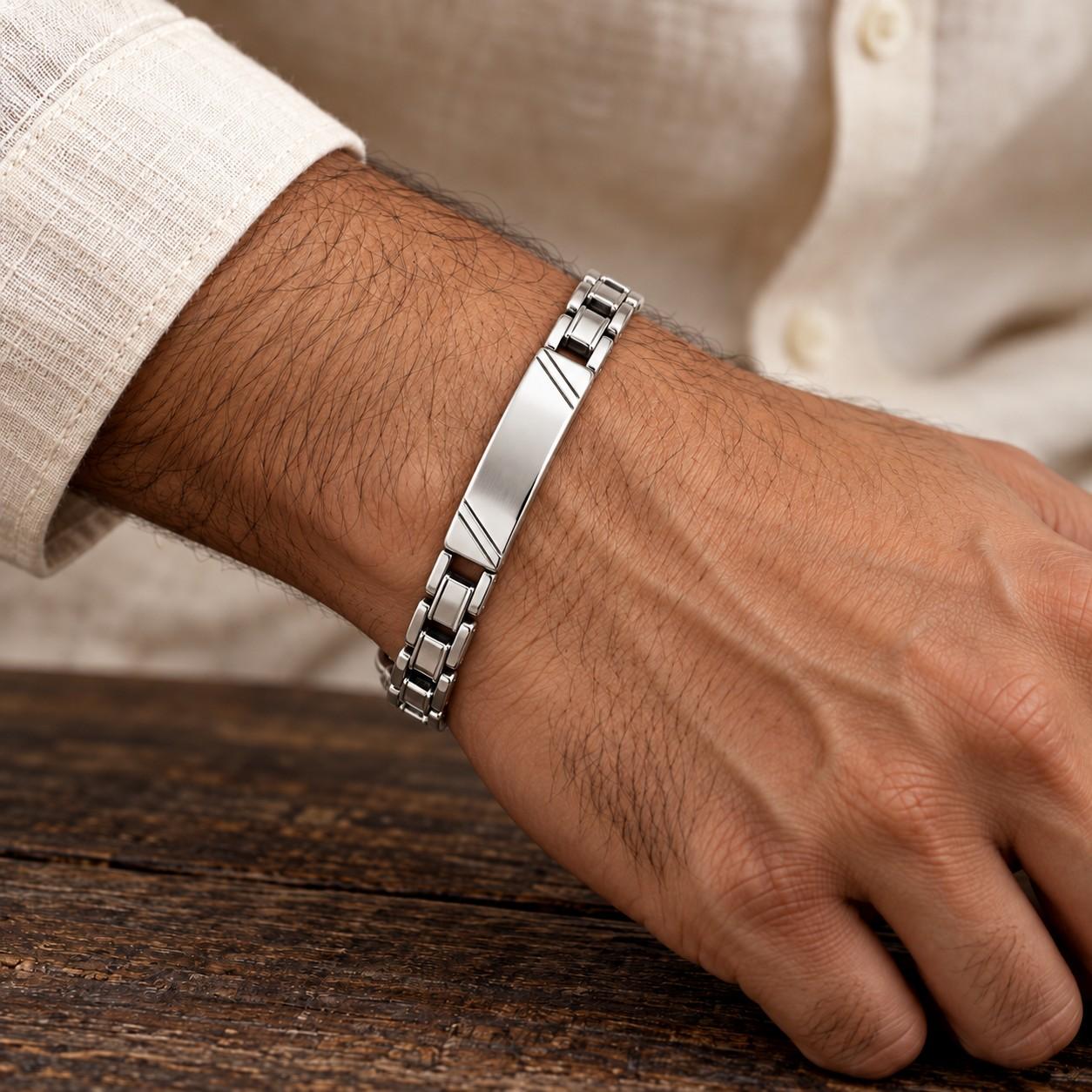 Silver-look men's ID link bracelet on the wrist