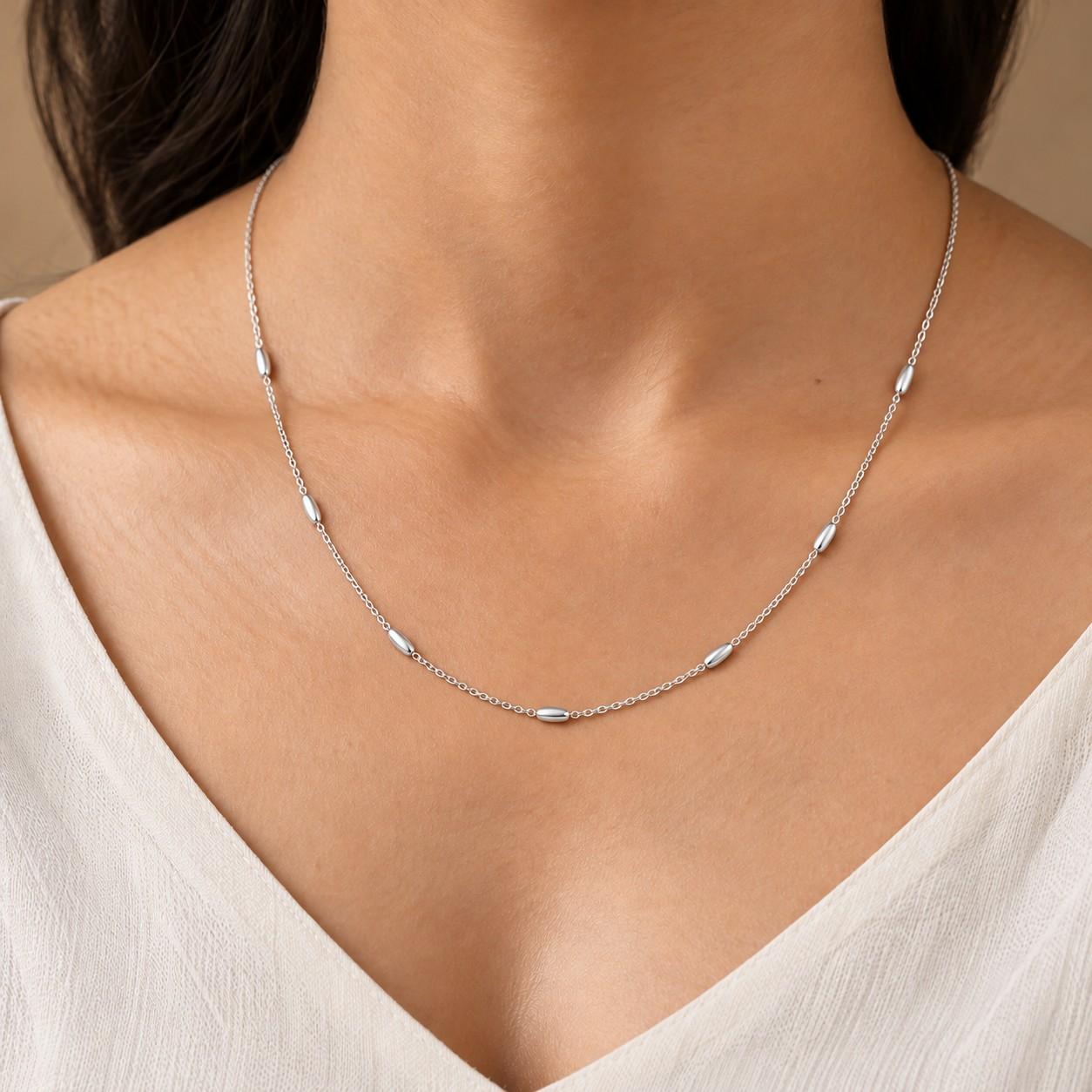 Delicate silver-look women's bead-station chain